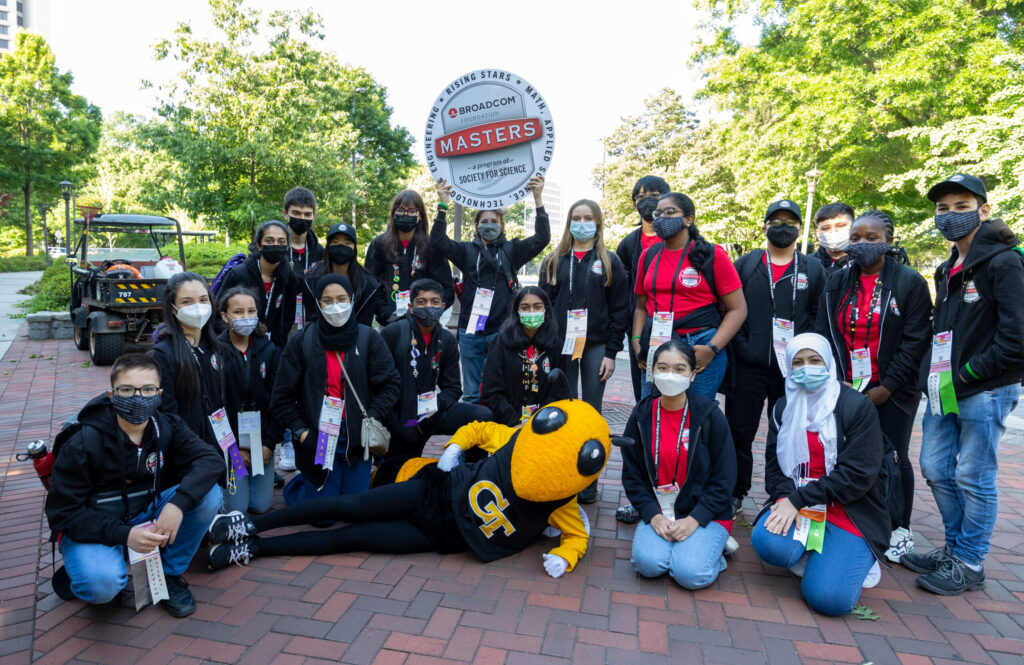 Broadcom MASTERS International students gather for a picture with Georgia Tech mascot Buzz