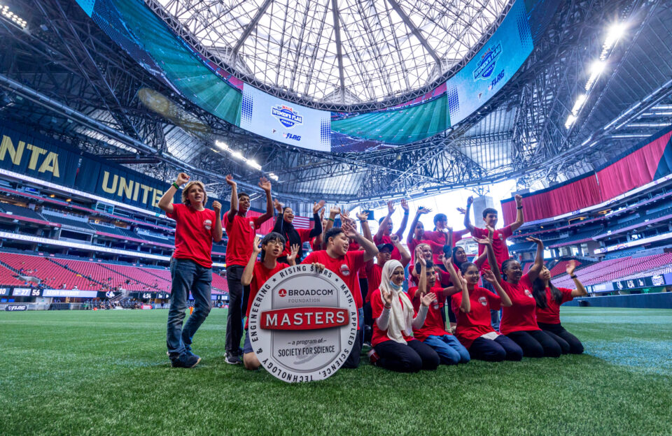2022 Broadcom MASTERS International delegates pose for a group photo inside the Mercedes Benz Stadium in Atlanta, Georgia