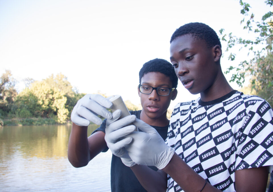 Students conducting water quality tests.