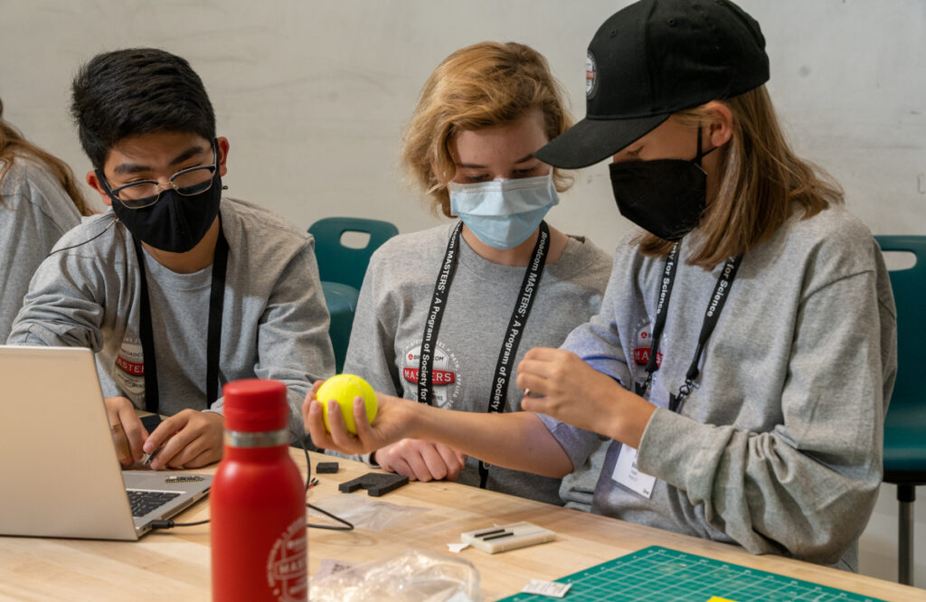 The silver team tests out muscle tremor detectors at George Mason University during 2022 Broadcom MASTERS finals week.