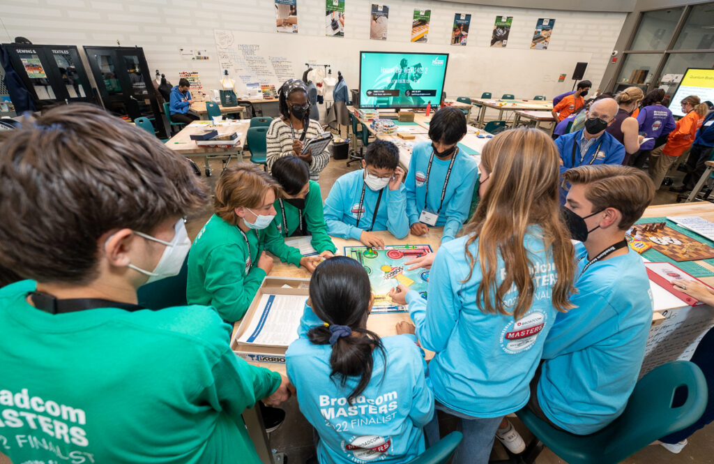 The green and blue teams practice their quantum physics board games during a challenge at George Mason University during Broadcom MASTERS 2022