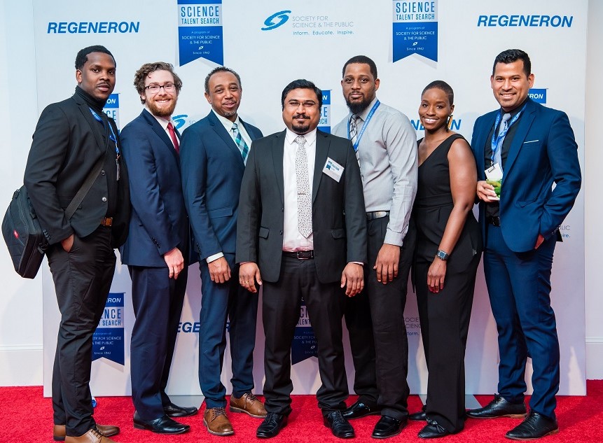 Randy Williams and colleagues posing for a photo at a Regeneron STS gala.