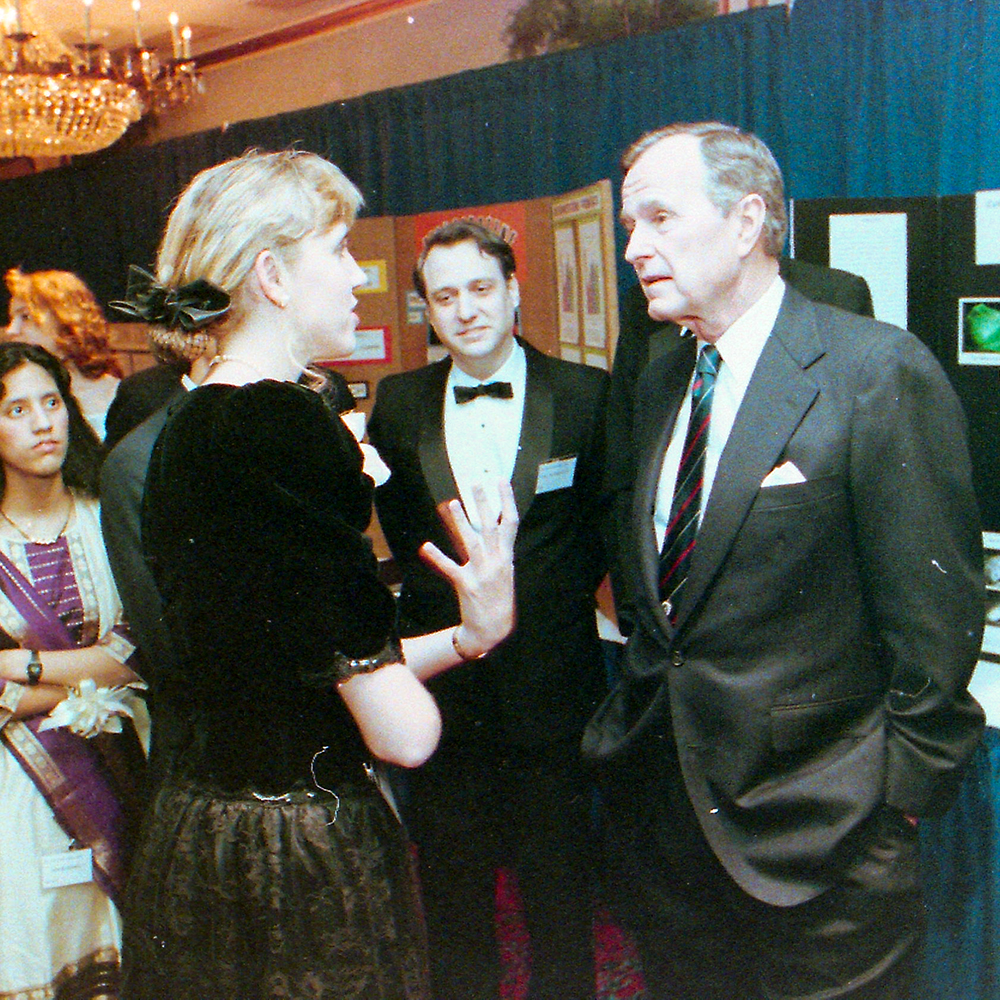 STS finalist Tessa Walters discusses her project with President George H. W. Bush