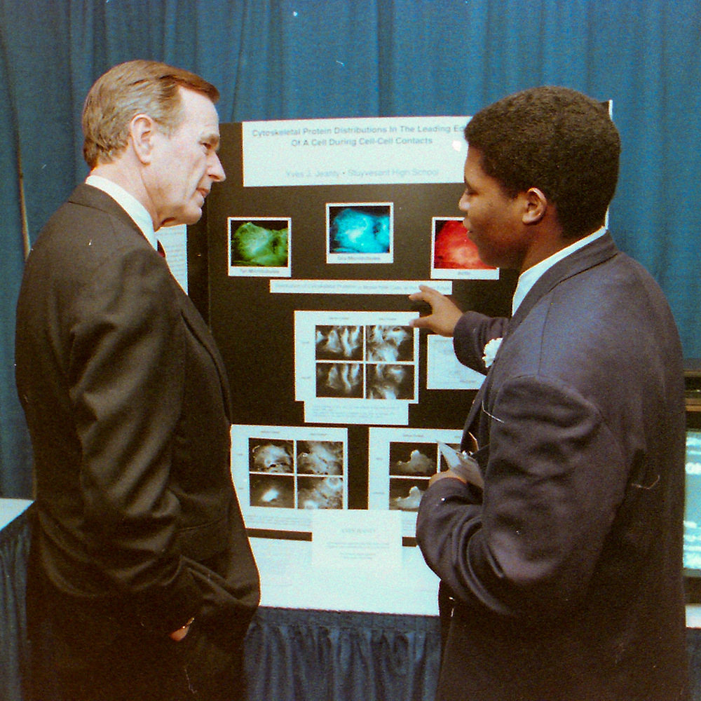 STS finalist Yves Jeanty discusses his research with President George H. W. Bush
