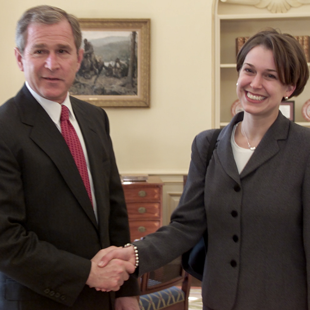 President George W. Bush shakes hands with Tzeitel Fetter Hirni