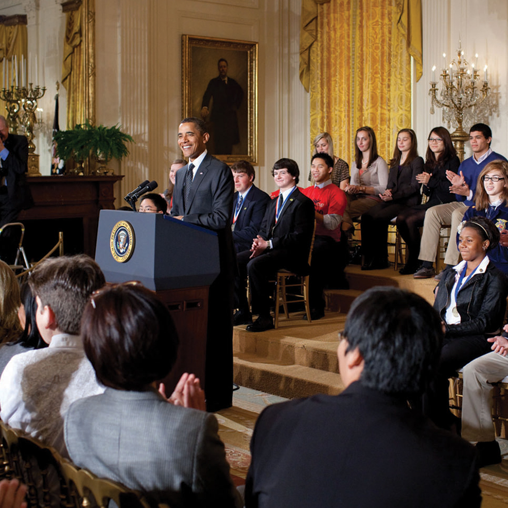 Alumni listen to President Obama’s speech at the White House Science Fair