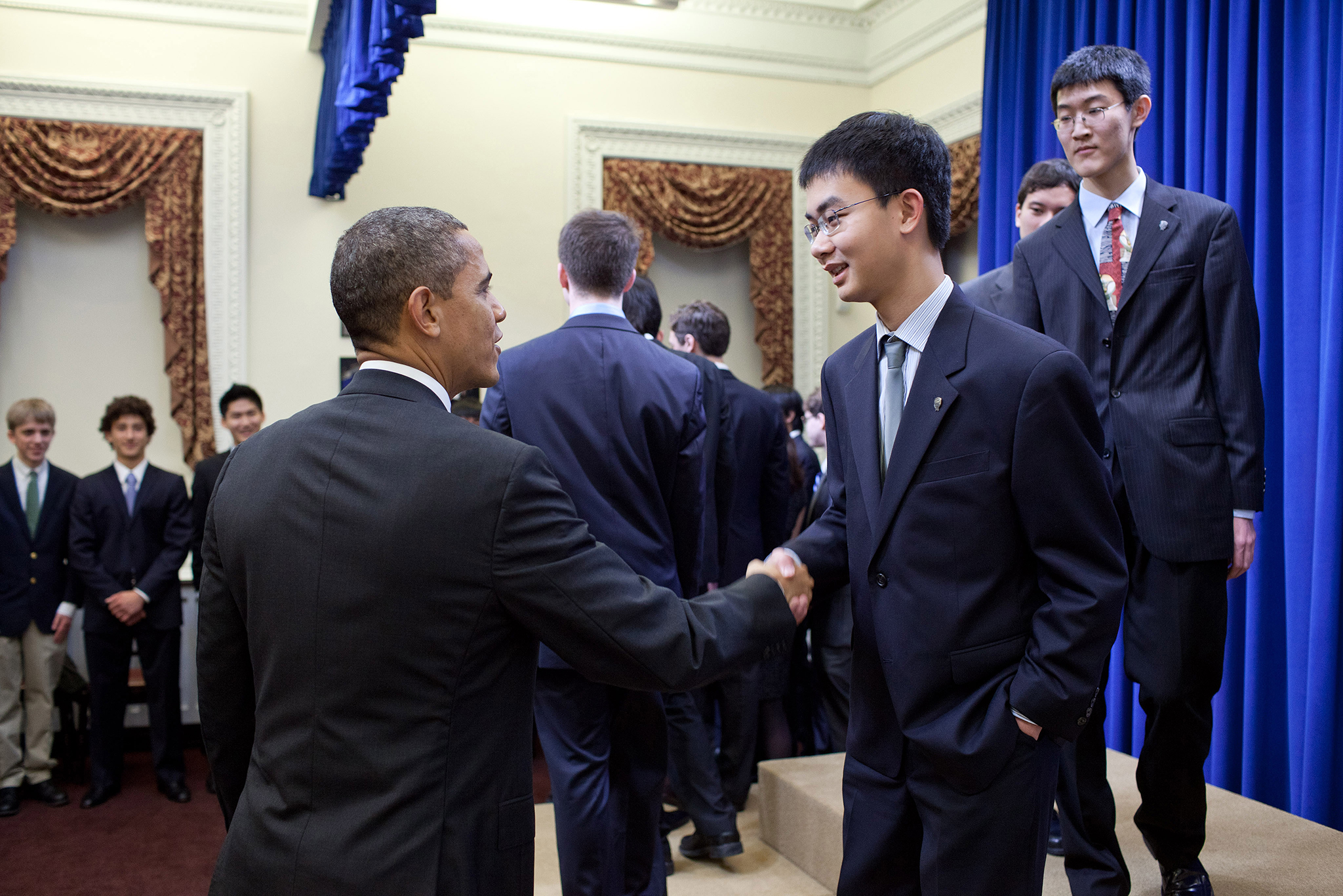 President Obama greets STS finalist Xiaoyu He at the White House