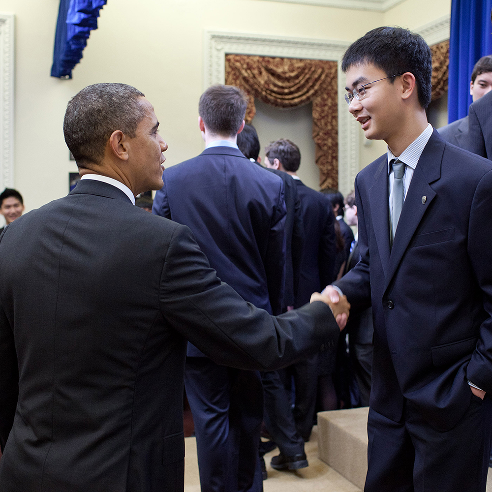 President Obama greets STS finalist Xiaoyu He at the White House