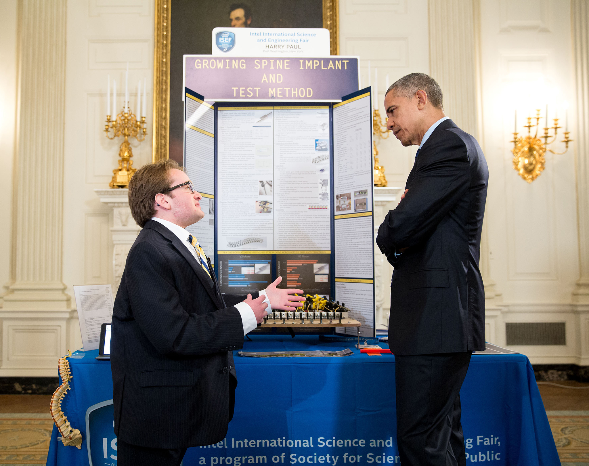 President Obama listens to Harry Paul discuss His project