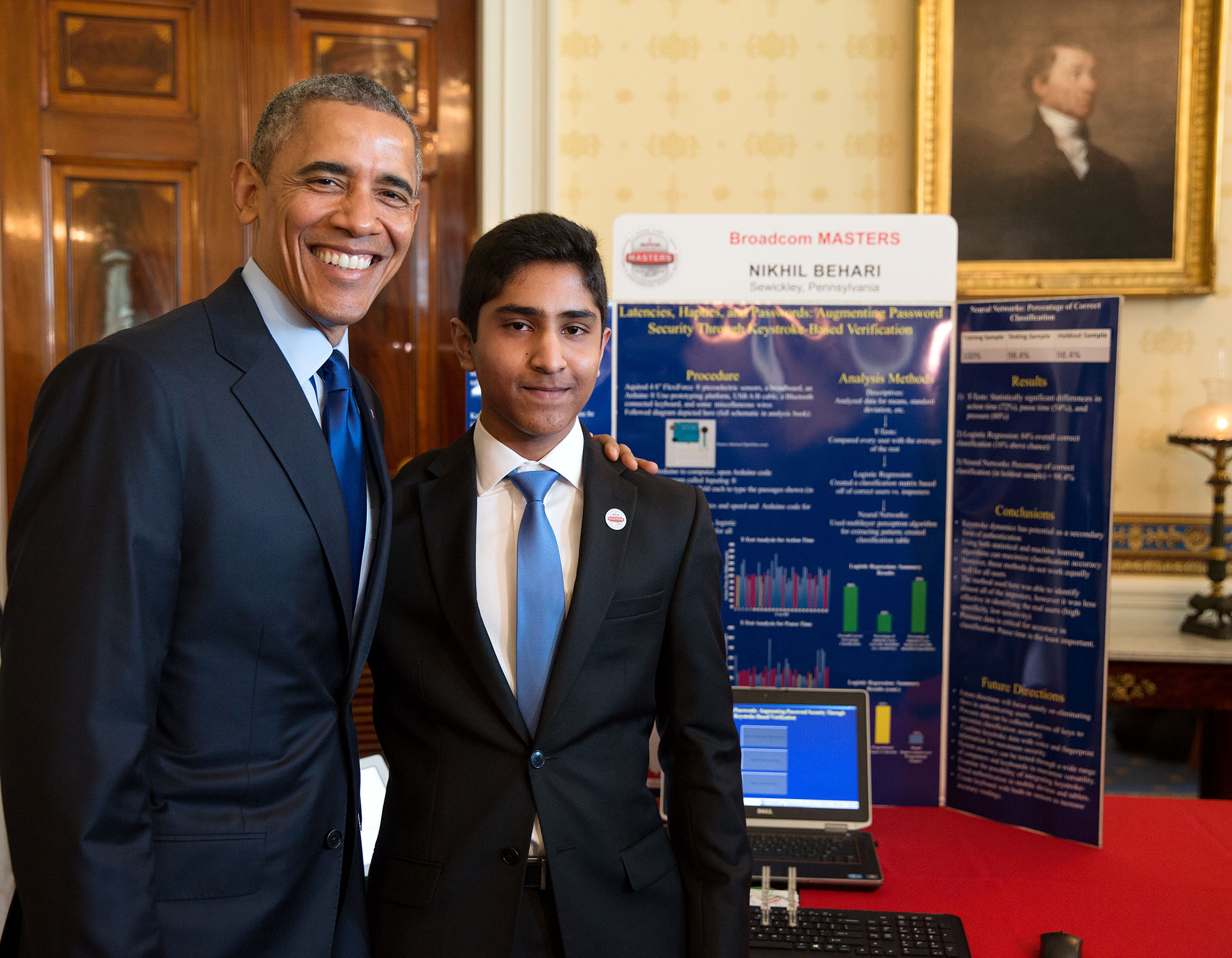 President Obama stands with Nikhil Behari in front of his project