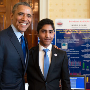 2015 President Obama stands with Nikhil Behari in front of his project