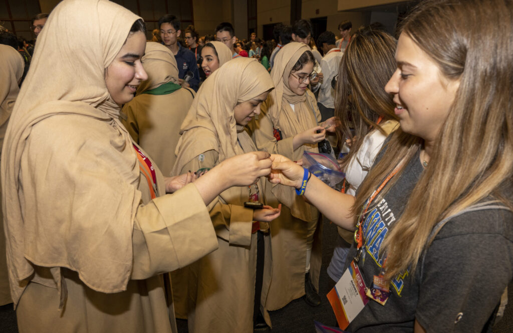 2023 Regeneron ISEF finalists exchange pins, buttons, small flags and even postcards during the pin exchange.