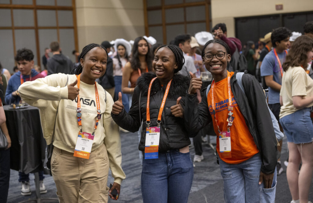2023 Regeneron ISEF finalists from Zimbabwe pose for a photo at the pin exchange.