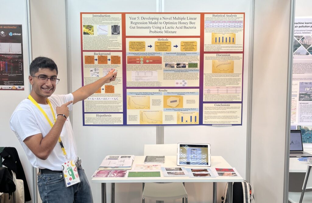 2022 Regeneron ISEF finalist, Varun Madan, posing in front of his research at the 2022 EUCYS.