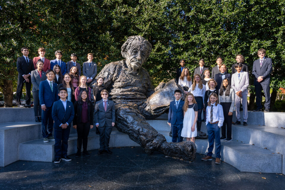 Middle school finalists pose with the Einstein statue.