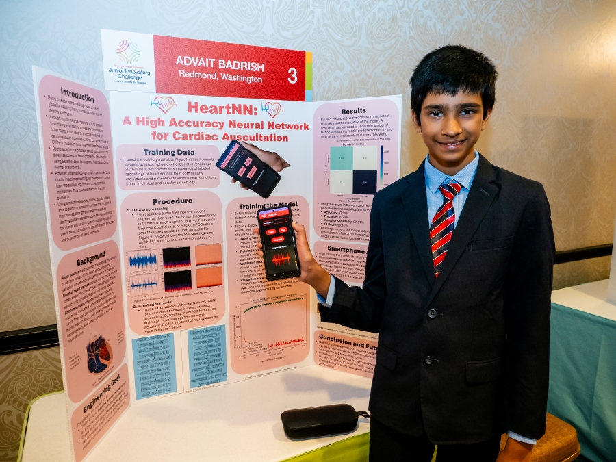 Advait Badrish standing at his project poster