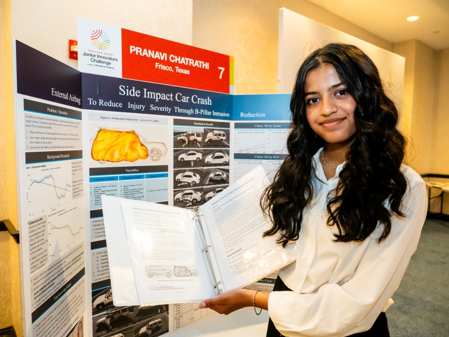 Pranavi Chatrathi standing at her project poster