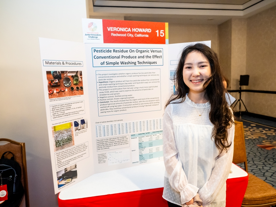 Veronica Howard standing at her project poster