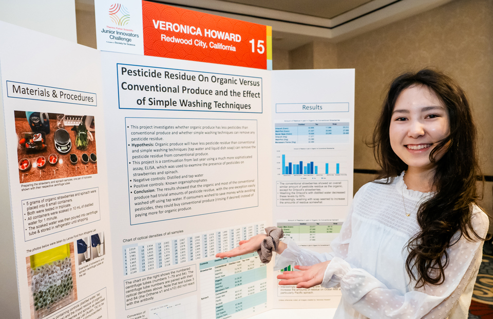 Veronica Howard standing at her project poster