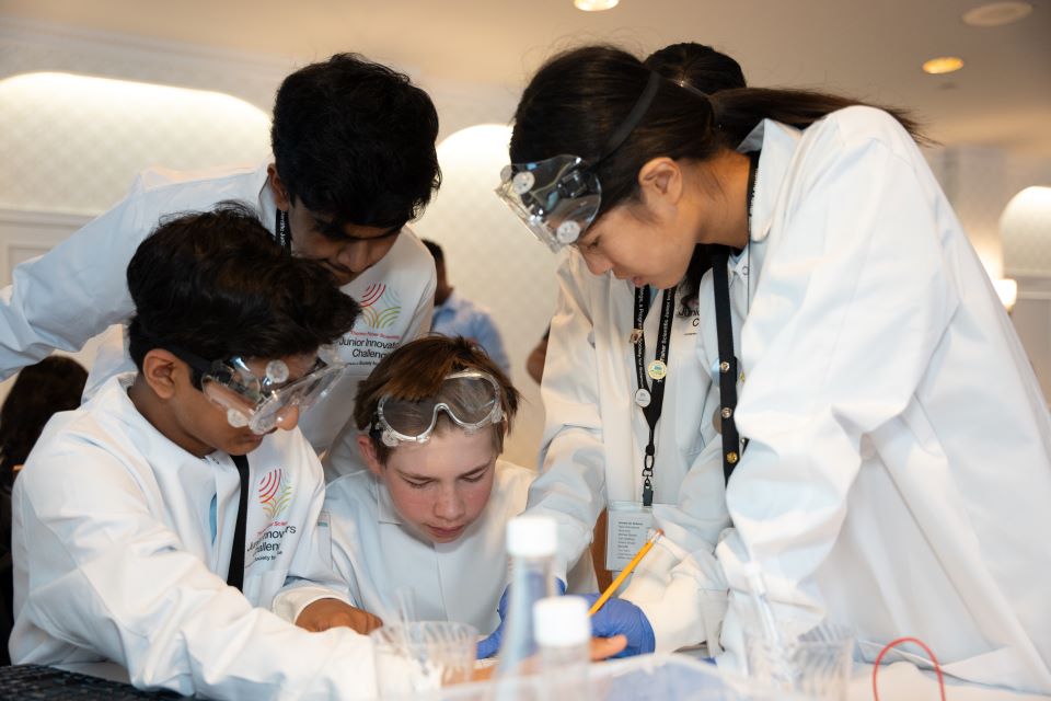 The blue team carefully examines their samples to ldetermine the nature of the pathogen.