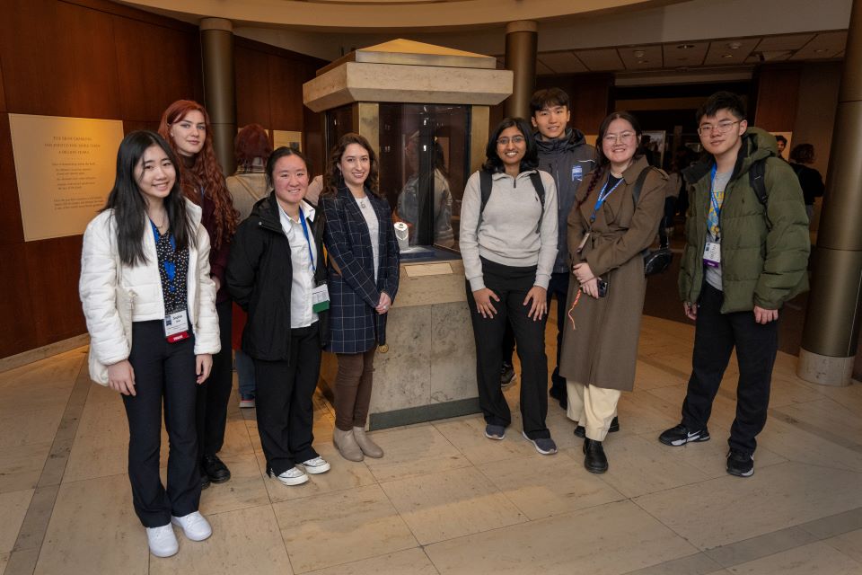 The finalists pose with STS alum Gabriela Farfan with the Hope Diamond at the National Museum of Natural History