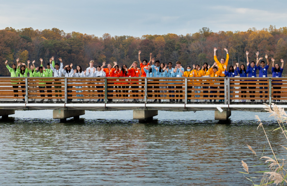 The 2023 JIC finalists on a dock cheering.