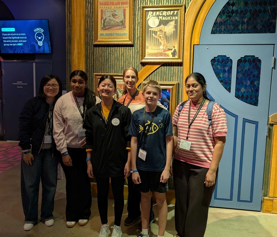 2025 Thermo Fisher JIC finalists pose for a group photo on the trip to Level 99