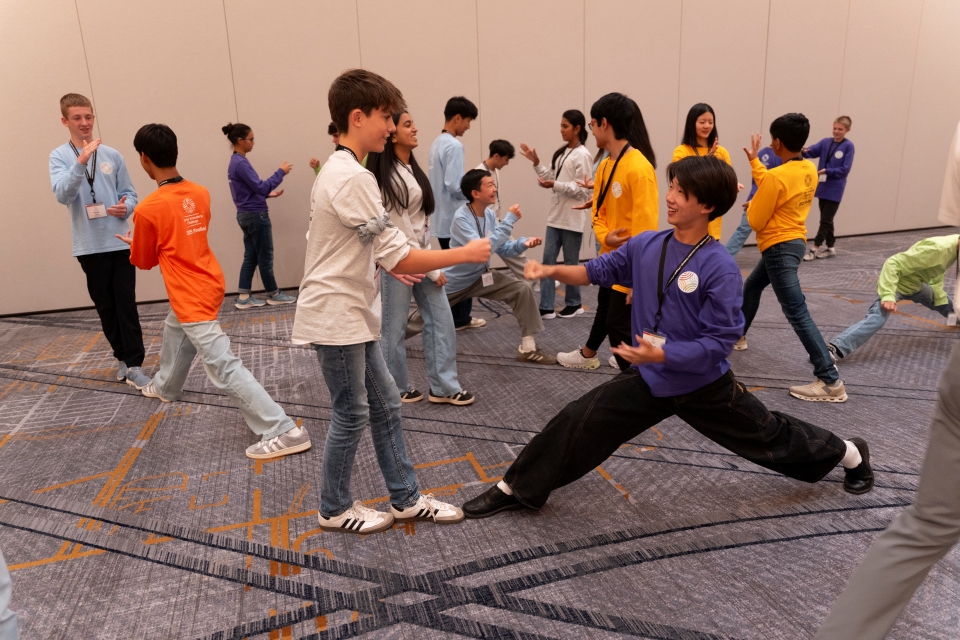 2025 Thermo Fisher JIC finalists playing rock, paper, scissors during ice breaker activities