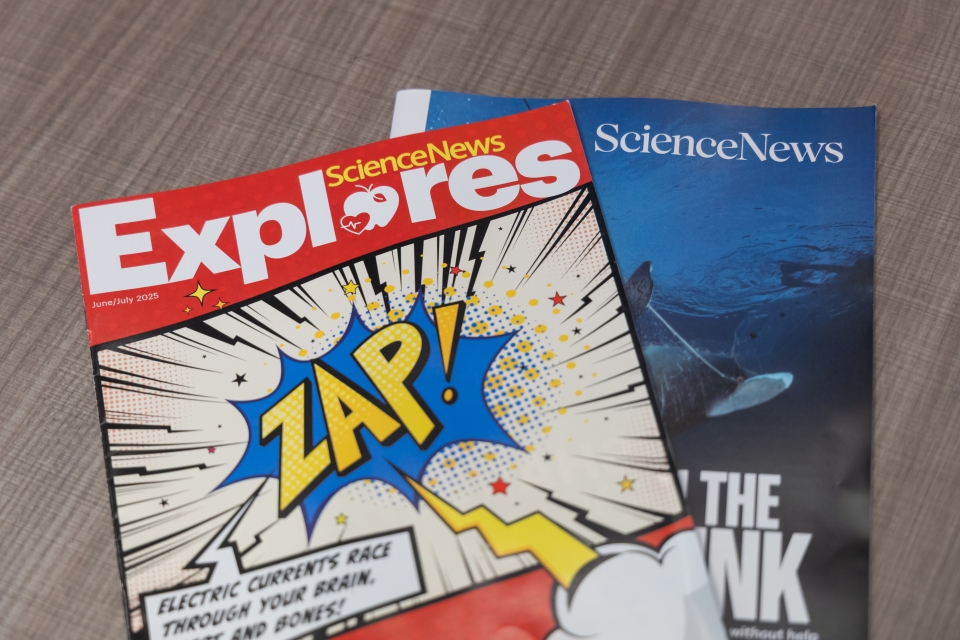 Copies of Science News and Science News Explores arrayed on a table