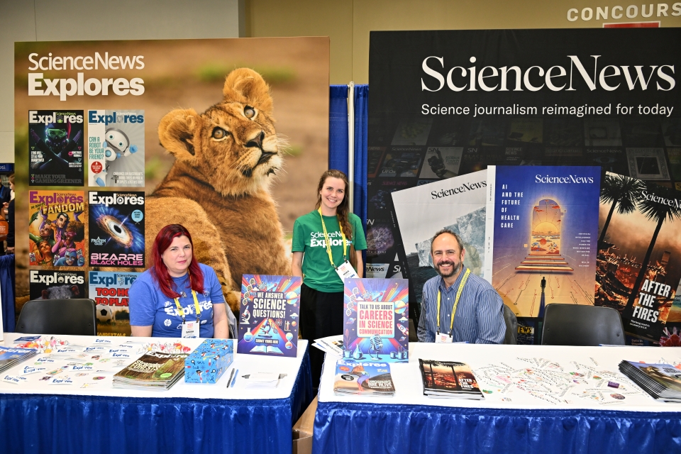 Maria Temming and two colleagues pose for a photo at the Science News Explores booth at Regeneron ISEF 2025