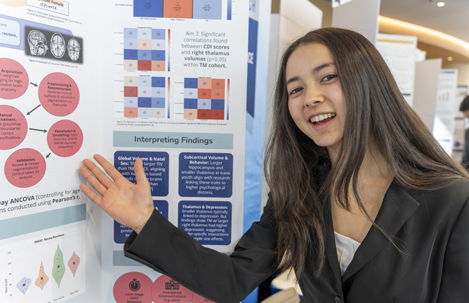 Regeneron STS 2025 finalist Charlotte Ava Rosario presenting her research poster at Public Day.
