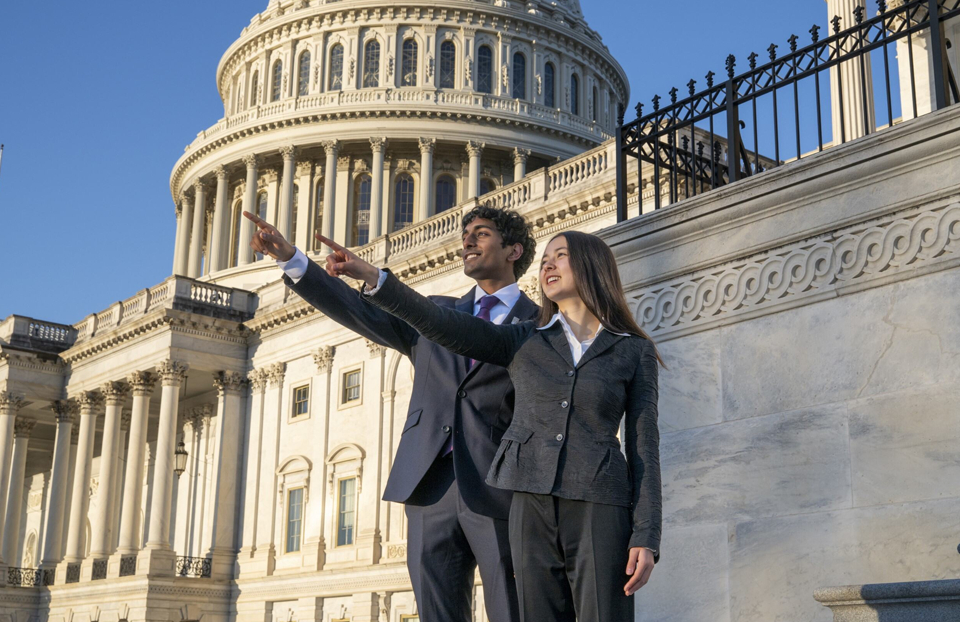 Regeneron STS 2025 finalists Addison Shea and Hrithik Ketineni on the steps of the US Capitol building in Washington DC.