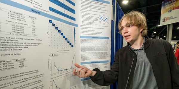 2023 STS Finalist Joshua Shunk with his project at the 2022 ISEF in Atlanta