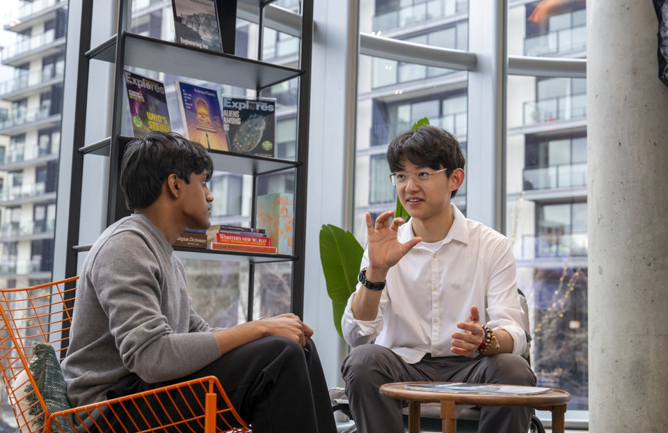 Regeneron STS 2025 finalists Thanush Patlolla and Minghao Zou having a conversation.