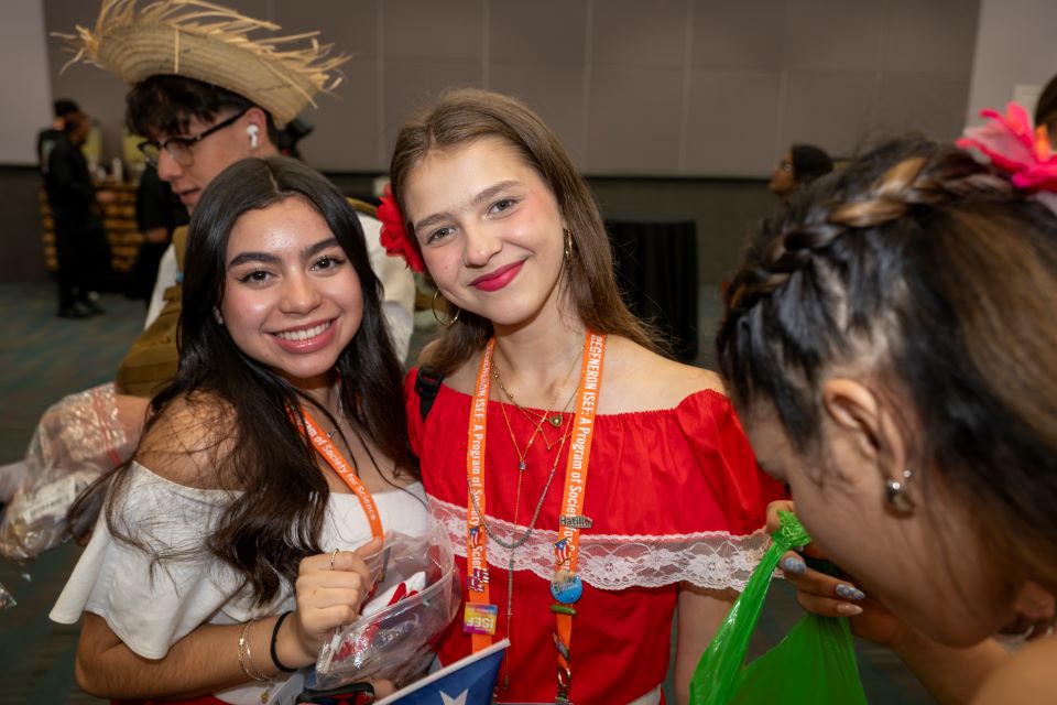 2024 ISEF - Two finalists pose together at the pin exchange.