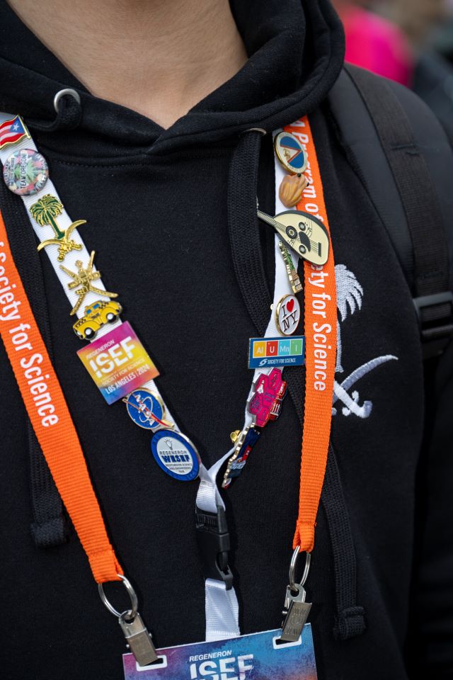 2024 ISEF - A finalists lanyard filled with pins.