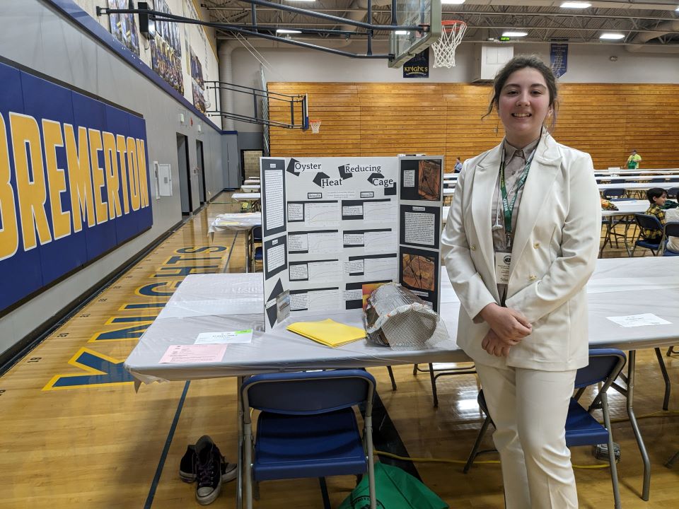 Lemelson Early Inventor Prize winner showcasing their newly designed oyster cage for protecting oysters from extreme heat.