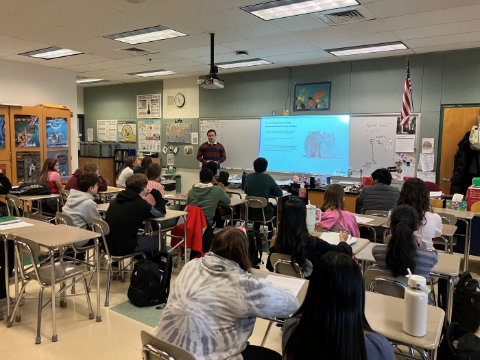Regeneron scientist presenting to students in a classroom