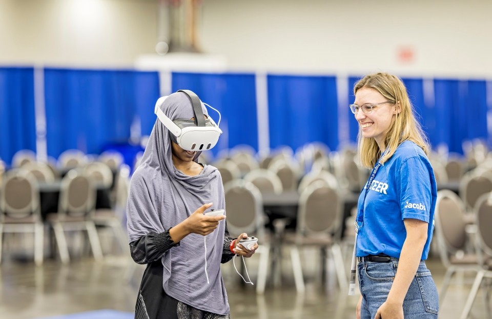 Volunteers and exhibitors guided students in interactive STEM demonstrations.