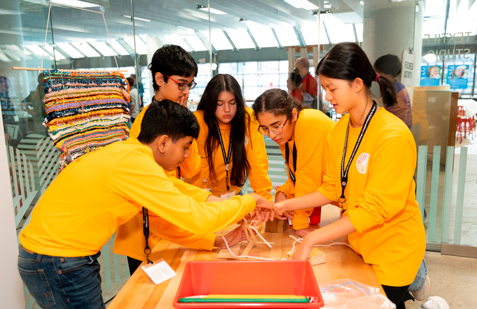 The 2025 Thermo Fisher JIC Gold Team during a challenge at the KID Museum in Bethesda, Maryland.