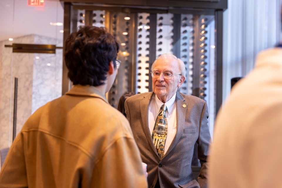 Ted Hoff speaks with a Regeneron STS finalist
