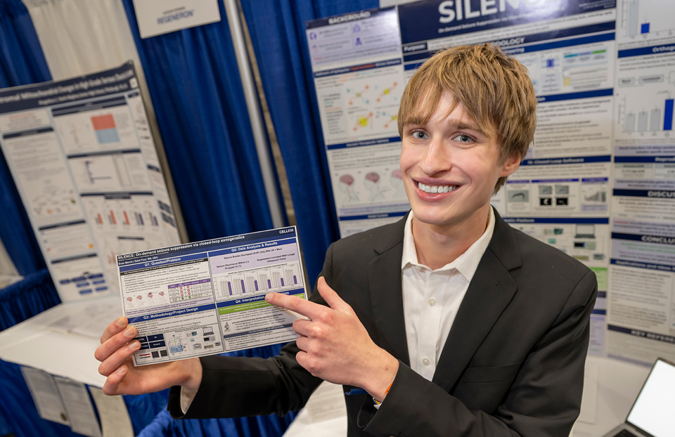 Grand Award Winner ISEF 2026, Phoenix: Evan Morris, 18, of Saint Paul, Minnesota, received the $10,000 Mary Sue Coleman Award for Life Science Innovation & Impact  for his low-cost system to detect and interrupt seizure-like behavior in a worm model.