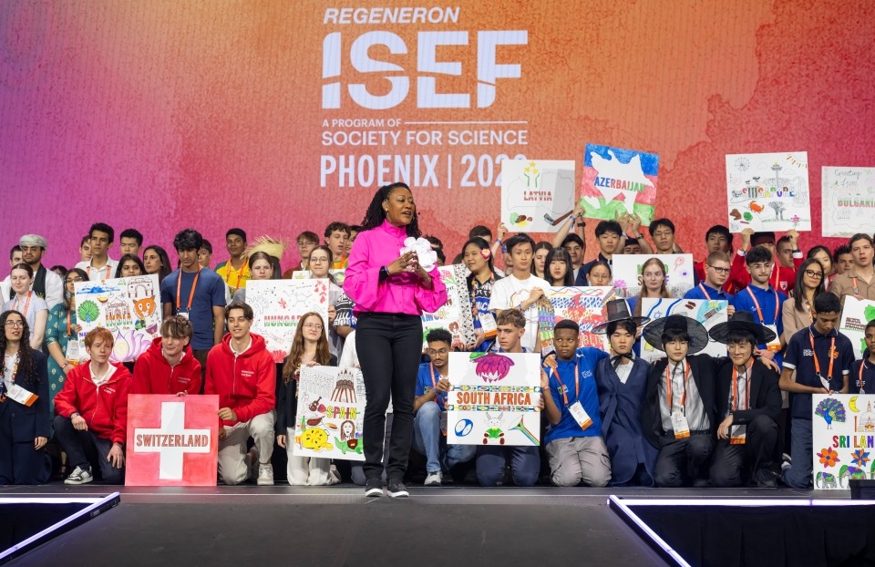 Host Barb Baker on stage with ISEF finalists