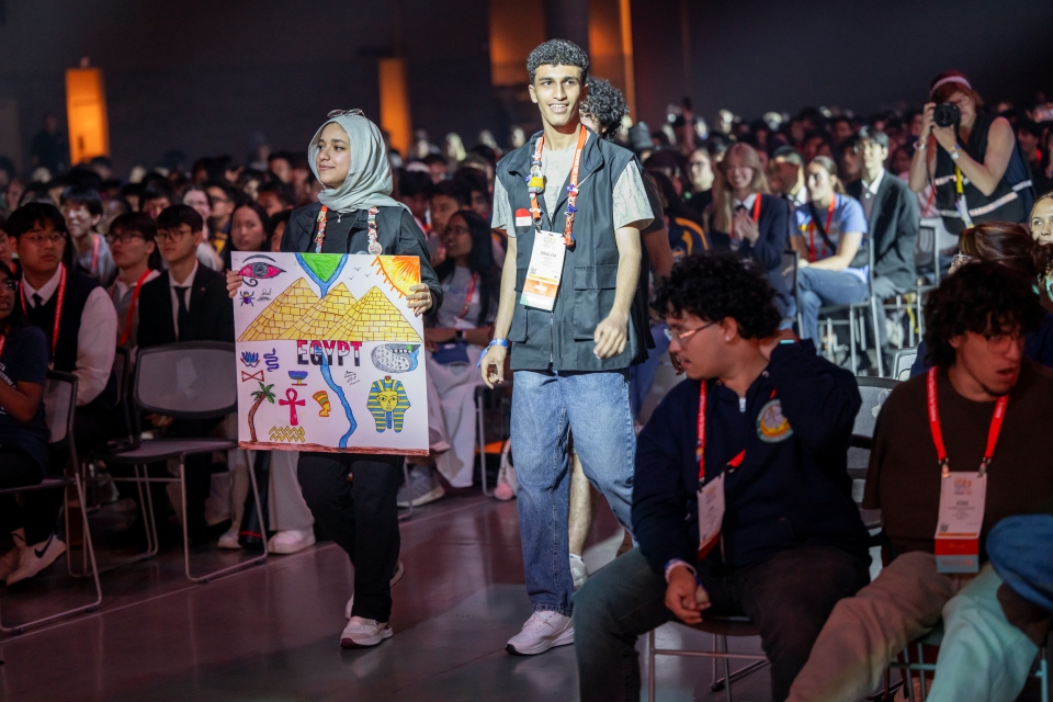 ISEF finalists from Turkey hold their country sign