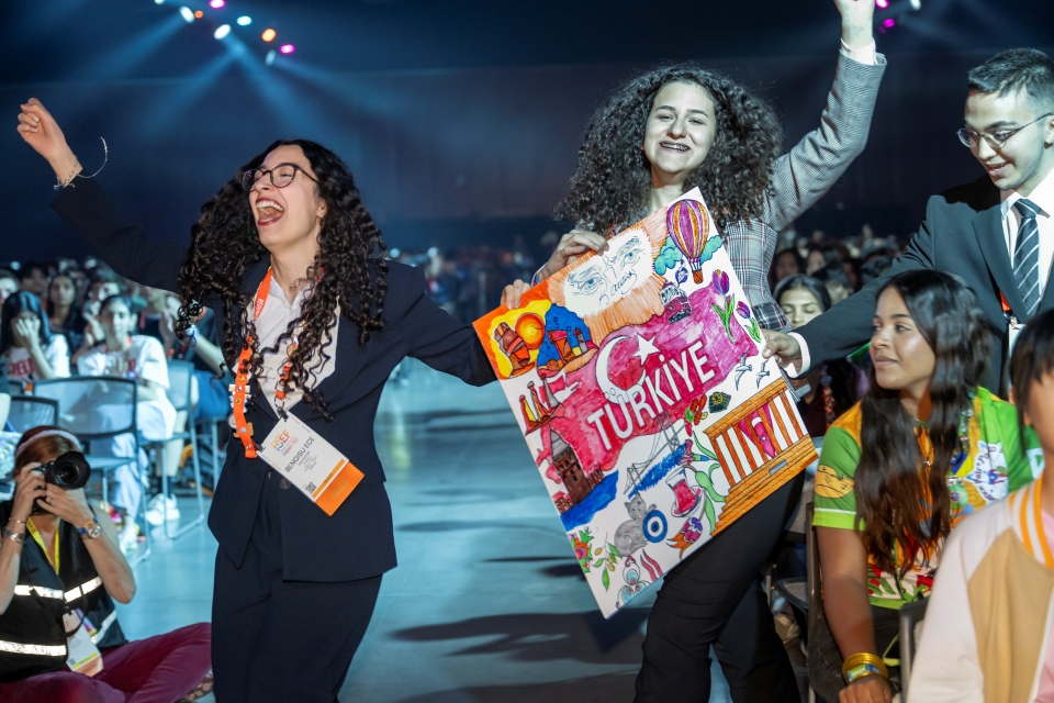 ISEF finalists from Turkey hold their country sign
