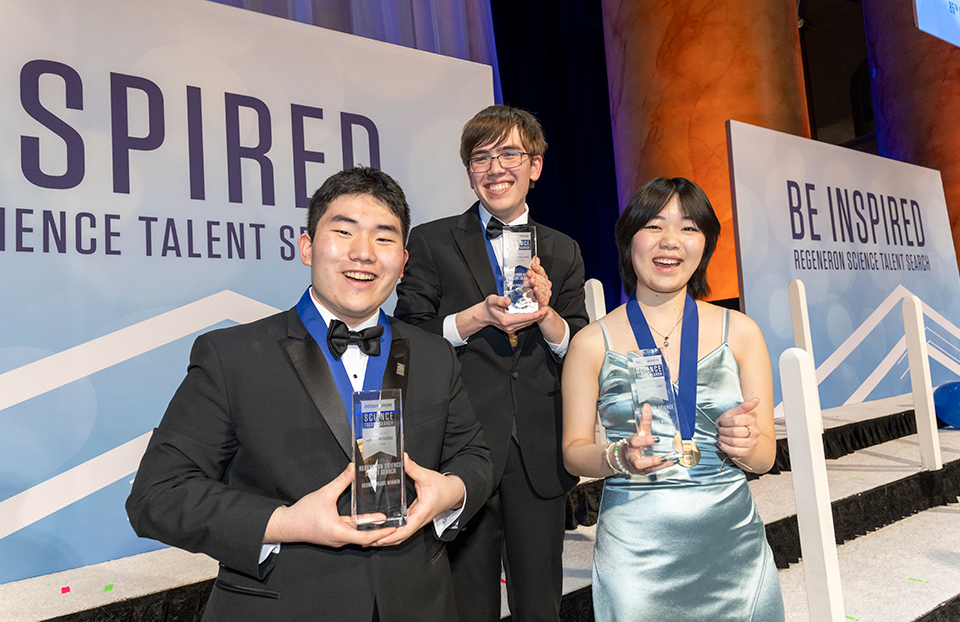 Regeneron STS 2026 top three award winners Edward Kang, Connor Hill, and Iris Shen.