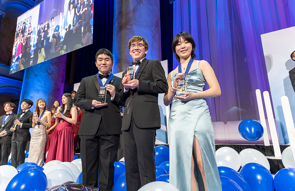 Regeneron STS 2026 top three award winners Edward Kang, Connor Hill, and Iris Shen.