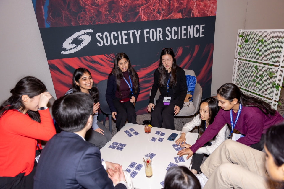 Regeneron STS finalists playing Cambio in the lounge