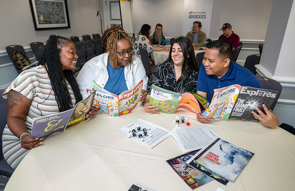 2026 Advocates reading the latest Science News and Science News Explores magazines.