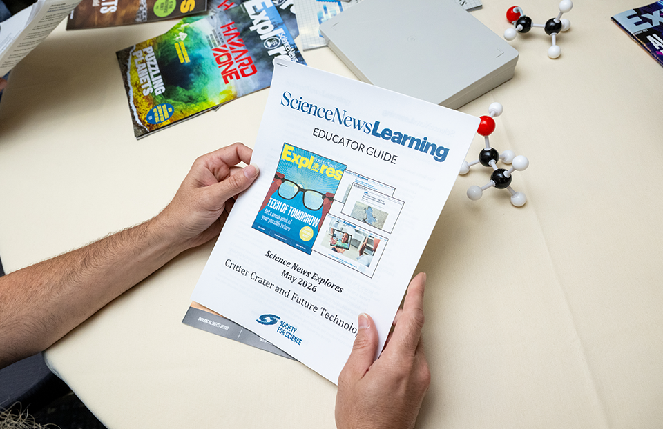 An educator reading the May 2026 Science News Learning Educator Guide.